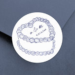 Hand Drawn Vintage Cake Navy Blue Wedding Classic Round Sticker<br><div class="desc">Personalised Vintage Cake Wedding Monogram Stickers. These custom round wedding stickers feature a simple vintage-style cake illustration at the centre, topped with the couple’s monogram initials and wedding date for a timeless and elegant touch. The minimalist design uses a mix of handwritten and script fonts in classic navy blue, keeping...</div>