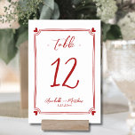 Hand Drawn Whimsical Red Wedding Table Number<br><div class="desc">Elegant Hand Drawn Whimsical Wedding Table Number. This adorable table number card features a subtle, hand-drawn frame with black hearts in each corner, creating a fun yet elegant design that gently encircles the table number. The mix of script and handwritten-style fonts adds a stylish and personal touch, making it both...</div>