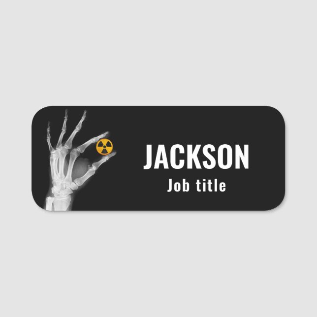 Hand Holding a Radiation Symbol Name Tag (Front)