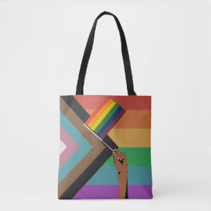 Hand Holding Pride Flag Tote Bag
