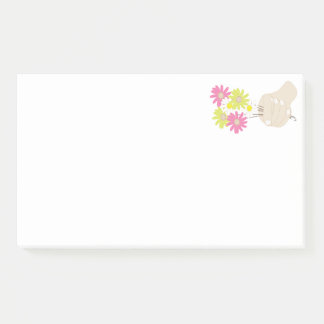 hand holds flowers post-it notes