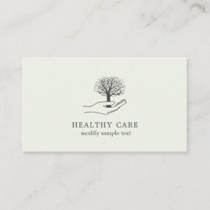 Hand holds tree business card