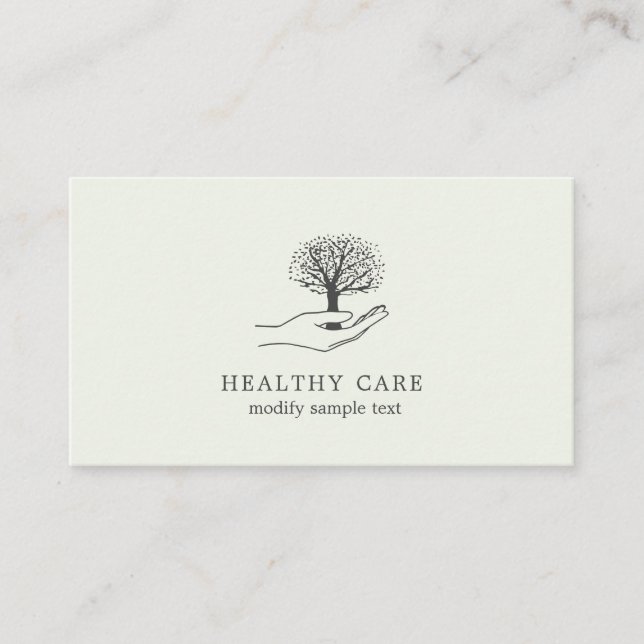 Hand holds tree business card (Front)