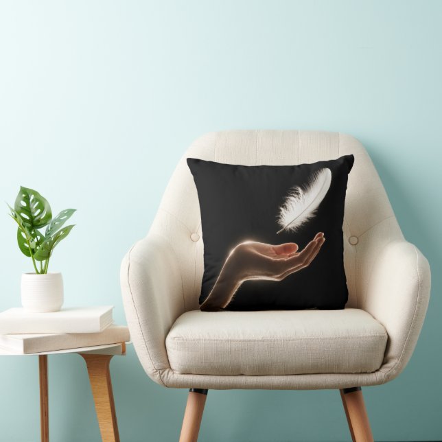 Hand Releasing a White Feather Cushion (Chair)