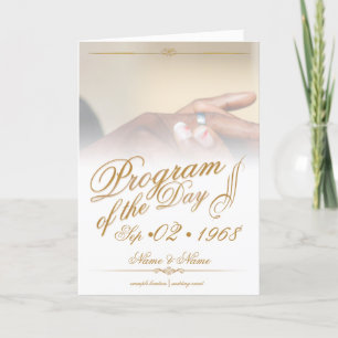 Hands of a coloured wedding couple pin on ring gol announcement