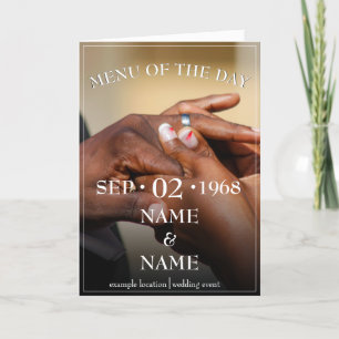 Hands of a coloured wedding couple pin on ring holiday card