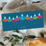 Hanukkah Card | Colourful Oil Lamp Menorah | Teal<br><div class="desc">Celebrate Hanukkah with a vibrant and contemporary greeting card design. This menorah is formed from colourful bowl-shaped oil lamps, each with a glowing flame, arranged in a cheerful display. The centre lamp highlights a faux-foil Star of David, adding both meaning and elegance. Perfect for families who enjoy modern and artistic...</div>