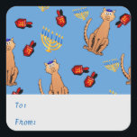 Hanukkah Cat Dreidel Blue Gift Tag Sticker<br><div class="desc">Cat lovers will be delighted with this fun whimsical "Hanukkat" pattern gift tag sticker, featuring an orange brown curious tabby cat wearing a kippah, red dreidels and yellow menorahs/channukiahs on a bright blue background. Perfect for wrapping your Hannukah / Chanukah gifts during the Jewish Festival of Lights! Personalise the text...</div>