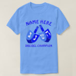 Hanukkah Dreidels In Blue Cute Dreidel Champion T-Shirt<br><div class="desc">Add a name to this funny Dreidel Champion Hanukkah tee shirt for a personalised gift or as a little treat for yourself. The bold graphic design of the two Dreidels in bright shades of blue and white includes a template for your name above with "Dreidel Champion" below, which can also...</div>