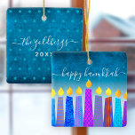 Hanukkah Menorah Candles Turquoise Keepsake Custom Ceramic Ornament<br><div class="desc">“Happy Hanukkah.” A playful, modern, artsy illustration of boho pattern candles helps you usher in the holiday of Hanukkah in style. Assorted blue candles with colourful faux foil patterns overlay a turquoise gradient to white textured background. On the back, personalise with your family name and year, over a tiny turquoise...</div>