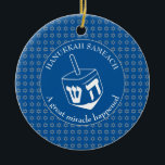 HANUKKAH SAMEACH | Dreidel | Chanukah Ceramic Tree Decoration<br><div class="desc">Stylish HANUKKAH SAMEACH Ornament with faux silver Star of David in a tiled pattern and a large white dreidel at the centre. The background colour is Tekhelet Blue. The text reads HANUKKAH SAMEACH at the top and A GREAT MIRACLE HAPPENED at the bottom. Both are CUSTOMIZABLE if you wish to...</div>
