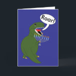 Hanukkah Tyrannosaurus Rex Dinosaur Custom Holiday Card<br><div class="desc">A green Tyrannosaurus Rex Dinosaur holds a menorah and says "Roar!" against a blue background.  The inside text says,  "Roar" is dinosaur for Happy Hanukkah! All text on card front and inside is customisable and can be personalised to fit your needs!</div>