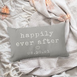 Happily Ever After | Custom Wedding Date Lumbar Cushion<br><div class="desc">Create a sweet keepsake with our neutral grey pillow featuring "happily ever after" in soft ivory vintage typewriter lettering. Personalise with a wedding or anniversary date for a perfect gift for newlyweds or your favourite couple. A small heart in the centre completes the design.</div>