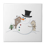Happy Christmas Snowman Illustration Tile<br><div class="desc">Illustration of a cartoon style Christmas snowman in a snow scene with snow covered houses and a tree in the background.</div>