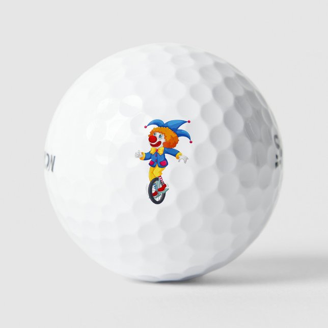 Happy Clown Golf Balls (Illustration of a clown riding a unicycle, the clown has white skin, light blue eyes. )