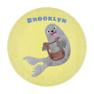 Happy cute harp seal cartoon illustration cutting board