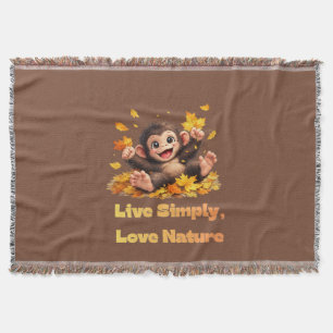 Happy Cute Monkey Playing in Falling Autumn Leaves Throw Blanket
