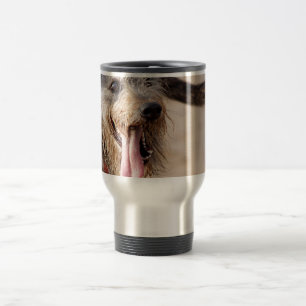 Happy dog on a beach travel mug