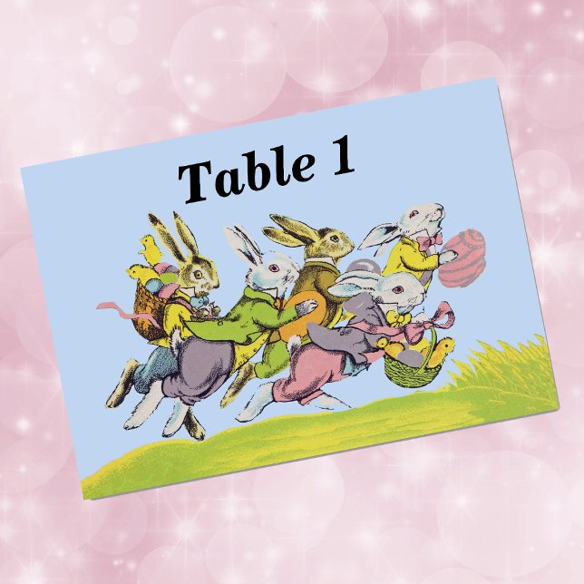 Happy Easter Running Pastel Rabbits Table Number (Group of Easter bunnies with eggs baskets running in grass on sky blue event table cards.)
