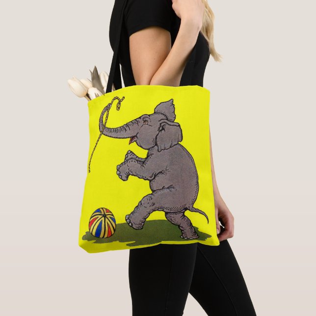 happy elephant playing with rope and ball tote bag (Close Up)
