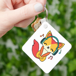 Happy fox with headphones listening to music.  key ring