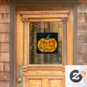 Happy Halloween lettering on carved pumpkin