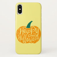 Happy Halloween lettering on carved pumpkin