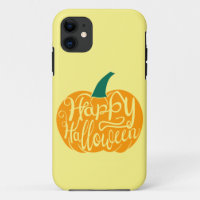 Happy Halloween lettering on carved pumpkin