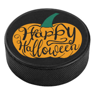 Happy Halloween lettering on carved pumpkin Hockey Puck