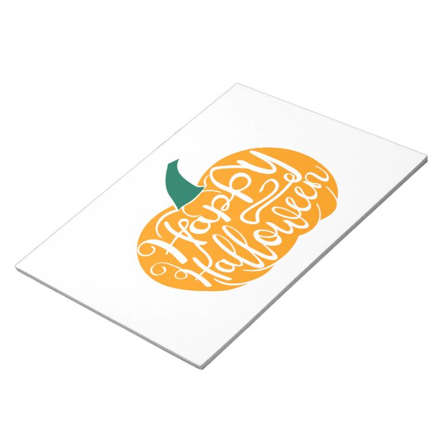 Happy Halloween lettering on carved pumpkin Notepad (Angled)