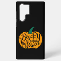 Happy Halloween lettering on carved pumpkin