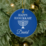 Happy Hanukkah blue menorah custom Jewish Holiday Ceramic Tree Decoration<br><div class="desc">Happy Hanukkah blue menorah custom Jewish Holiday Christmas tree ornament. Add your own custom name,  greeting or monogram letters. Personalised design for Jewish Holidays. Elegant x-mas decorations with religious candle holder symbol. Upload your own family photo on back optionally. Includes gold glitter string.</div>