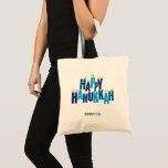 Happy Hanukkah Candles Holiday  Tote Bag<br><div class="desc">Make your Chanukah shopping and errands a little more festive with this tote bag, or use as a gift or favour. The greeting "Happy Hanukkah" is spelled out in blue tonal colours. The stacked letters serve as a menorah with small flames burning on top of nine "candle letters". Add your...</div>