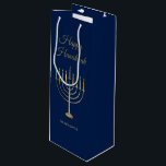 Happy Hanukkah Faux Gold Menorah Monogram Blue Wine Gift Bag<br><div class="desc">Wrap your gifts in style this holiday season with our elegant Hanukkah wine gift bags. This simple but chic design features a white background with a large faux gold menorah in the centre. Above, it reads, "Happy Hanukkah" and below is your family name to personalise. Designed by artists © Tim...</div>