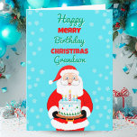 Happy Merry Birthday Christmas Santa Grandson Card<br><div class="desc">Celebrate your grandson’s Christmas birthday with a card that sparkles with joy! Santa Claus carries a festive birthday cake,  bringing together the magic of Christmas and the happiness of his special day. A cheerful way to show your grandson how loved he is during this holiday season.</div>