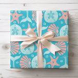 Happy Seashore | Nautical Beach Seashell Christmas Wrapping Paper<br><div class="desc">Beach theme Christmas gift wrap features a nautical pattern of seashells (Starfish,  Sand Dollars) and whale tails in shades of light blue and coral on a tropical turquoise background. Original artwork KL Stock.</div>