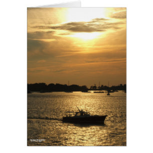 Harbour boat scene late evening sun behind clouds