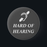 Hard Of Hearing White On Dark Grey 6 Cm Round Badge<br><div class="desc">International Symbol for the Deaf with the words HARD OF HEARING in white on a dark grey background.</div>