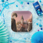 HARRY POTTER™ Hermione & Ron HOGWARTS™ Anime Scene Paper Plate<br><div class="desc">Step into the wizarding world with this stunning illustration featuring Harry Potter™, Hermione Granger, and Ron Weasley standing before the majestic towers of Hogwarts™ at sunset. Bathed in warm golden light and soft twilight hues, the trio stands ready for whatever magical adventure awaits. With wands in hand and Hogwarts rising...</div>
