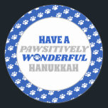 Have a Pawsitively Wonderful Hanukkah Classic Round Sticker<br><div class="desc">Introducing our delightful Hanukkah design featuring a charming border of white paw prints on a blue background. Embrace the festive spirit of Hanukkah with this design, which encloses a clean white background showcasing the heartfelt text "Have a pawsitively wonderful Hanukkah." The text is presented in blue and silver colours, with...</div>
