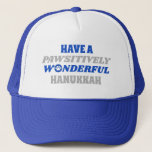 Have a Pawsitively Wonderful Hanukkah Trucker Hat<br><div class="desc">This delightful design showcases the heartfelt text "Have a pawsitively wonderful Hanukkah." The text is presented in blue and silver colours, with the letter "o" in "wonderful" playfully substituted with a paw print. This design captures the joy and celebration of Hanukkah with a pet-friendly twist. The combination of blue and...</div>