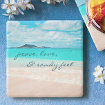 Hawaii Tropical Beach Peace Love Sandy Feet Script Stone Coaster<br><div class="desc">“Peace, love & sandy feet.” Relax with your favourite beverage on this stunning pastel-coloured photo stone coaster, all while you remind yourself of the fresh salt smell of the ocean air. Exhale and explore the solitude of an empty Hawaiian beach. Makes a great housewarming gift! You can easily personalise this...</div>