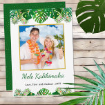 Hawaiian Mele Kalikimaka Christmas Lights Photo Holiday Card<br><div class="desc">This fun, modern holiday card design features lush tropical beach foliage on the front, including palm fronds and monstera philodendron leaves, decorated with glowing multicolored lights, at the top and bottom. In the middle is a customisable gold-edged square photo that you can replace with your own. Below the photo are...</div>
