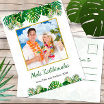 Hawaiian Mele Kalikimaka Christmas Lights Photo Holiday Postcard<br><div class="desc">This fun, modern holiday postcard design features lush tropical beach foliage on the front, including palm fronds and monstera philodendron leaves, decorated with glowing multicolored lights, at the top and bottom. In the middle is a customisable gold-edged square photo that you can replace with your own. Below the photo are...</div>