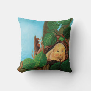 Hazel dormouse eating hazelnut cushion