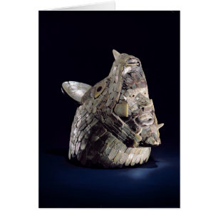 Head of an animal with human head in open jaws