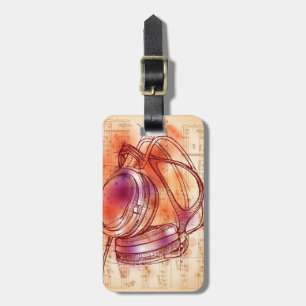 Headphones on a watercolor background & notes luggage tag