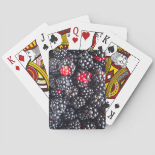 Heap of blackberries playing cards