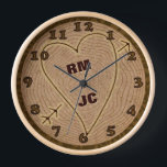 Heart Carved Initials Wood Tree Rings Personalised Clock<br><div class="desc">This beautiful clock is perfect for a wedding, anniversary or Valentine's Day. The graphic design has a wood texture look, like the top view of a tree stump complete with rings and a bark border. A heart with arrow has been carved into it, along with wooden-looking brown numbers. Use the...</div>