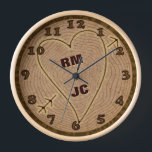 Heart Carved Initials Wood Tree Rings Personalised Clock<br><div class="desc">This beautiful clock is perfect for a wedding, anniversary or Valentine's Day. The graphic design has a wood texture look, like the top view of a tree stump complete with rings and a bark border. A heart with arrow has been carved into it, along with wooden-looking brown numbers. Use the...</div>